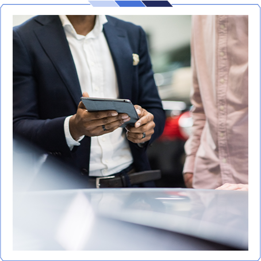 Part-Exchange Guide Sales manager showing a customer a part-exchange value