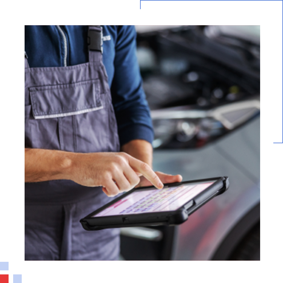Vehicle Check A mechanic running a vehicle check on an iPad